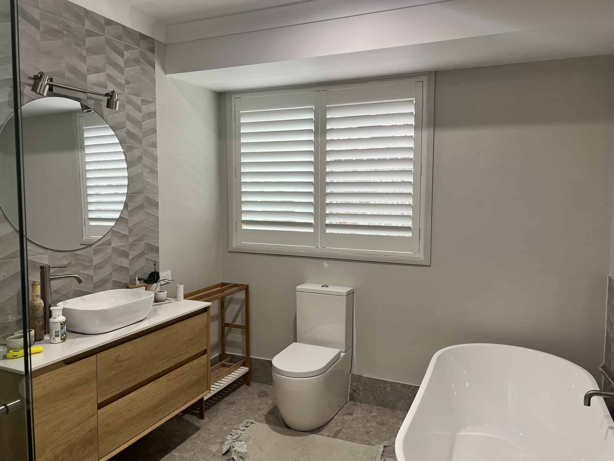 elevate-your-bathroom-retreat-with-internal-faux-wood-shutters-featured-image