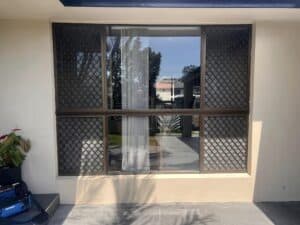 A sleek, modern Crimsafe screens with a stunning view